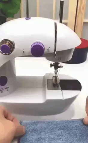Mini máquina de coser eléctrica